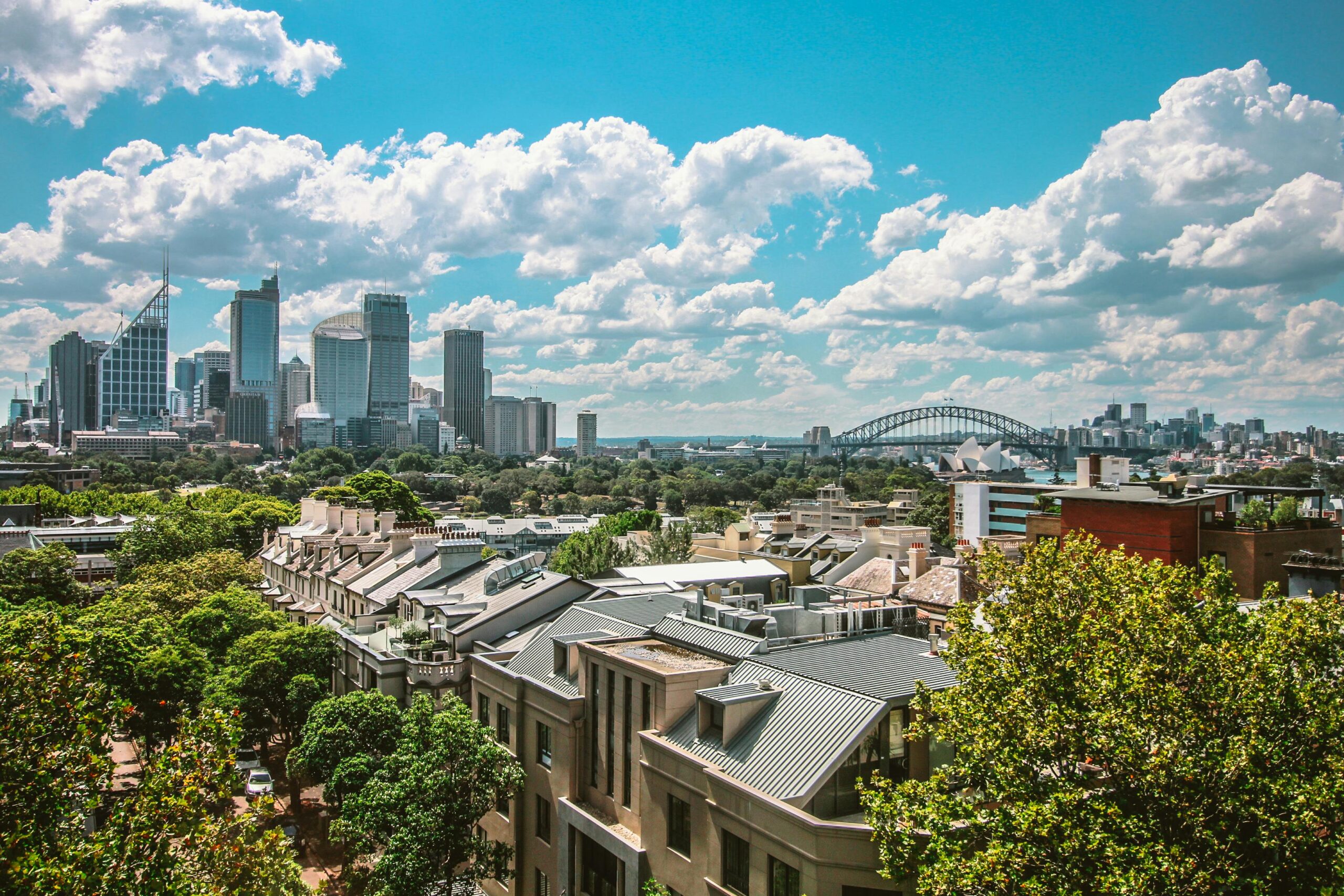 City skyline with lush greenery
